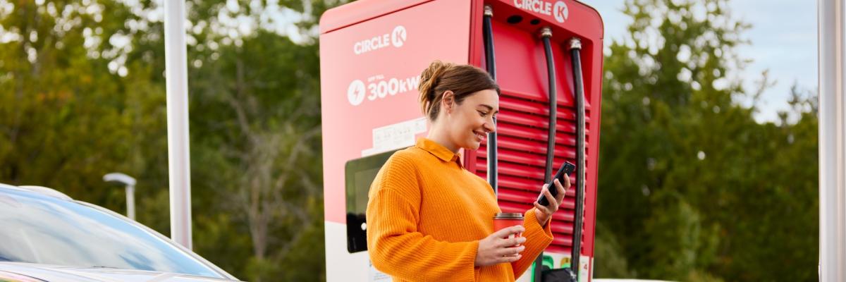Woman using autocharge to charge ev