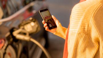 Woman using the circle k charge app