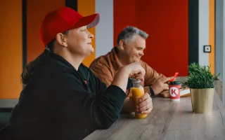 People sitting in Circle K taking a break eating and drinking